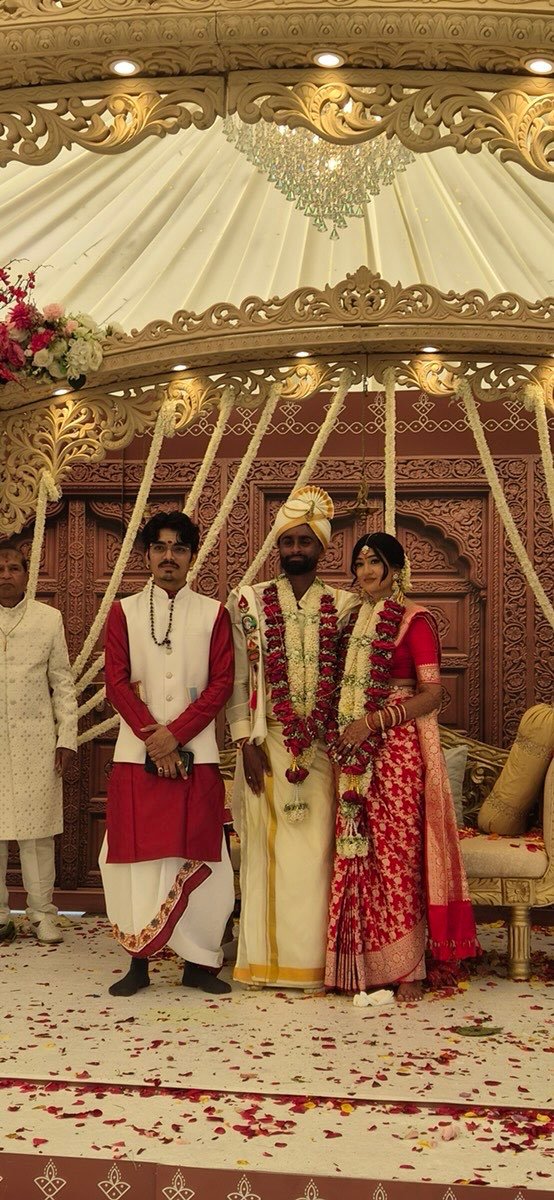 Bride and groom standing in the mandap after their wedding